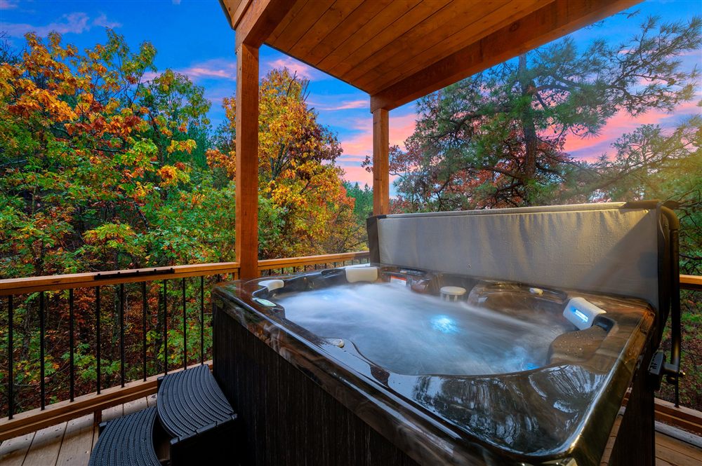 Adventus private hot tub on the back deck at dusk